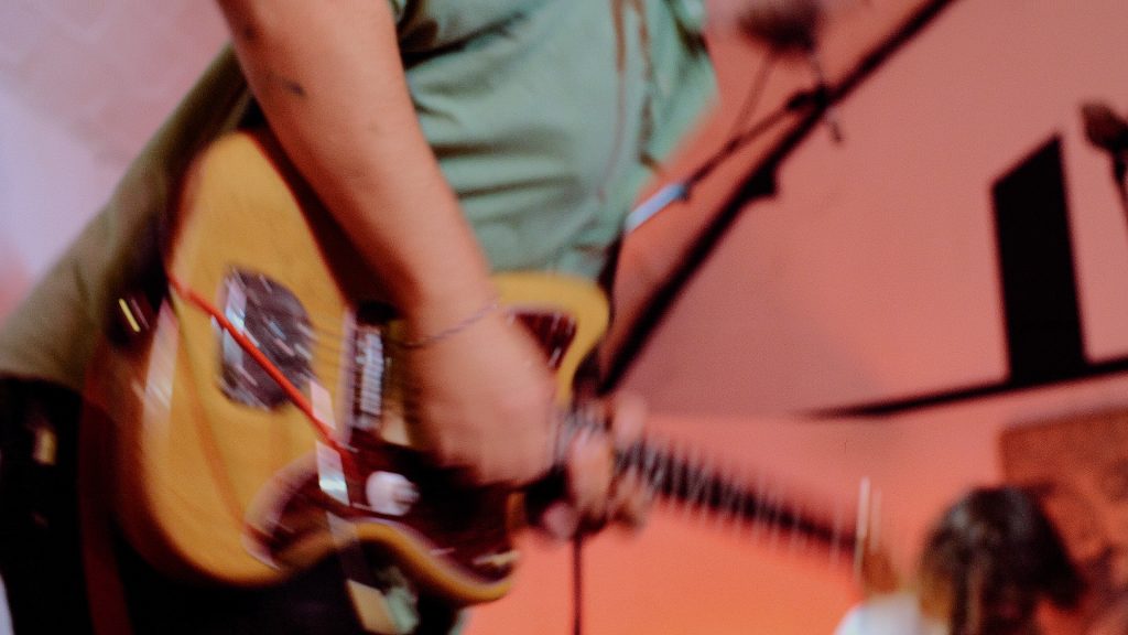 Guitarist plays during the Familiar Action live session at a music studio, Arcus Sounds in East London